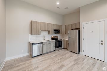 Northville apartment for rent - A kitchen with a refrigerator, dishwasher, and oven.