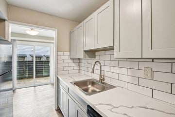 Houston apartment for rent - A kitchen with a sink and cabinets.