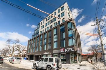 York apartment for rent - A KFC building with a white car parked in front.