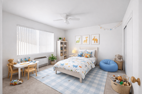 St. Louis Park apartment for rent - A bedroom with a bed, a desk, a chair, a window with blinds, a rug, a wall shelf, a ceiling fan, and a wall hanging.