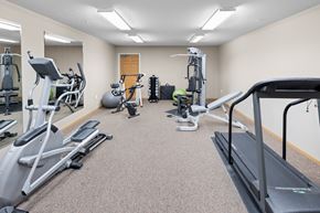 St. Cloud apartment for rent - A well-equipped gym with treadmills, exercise bikes, and other fitness machines.