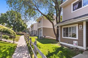 Plymouth apartment for rent - A residential area with houses and a clear sky.