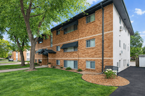 Richfield apartment for rent - A tree is in front of a brick building.
