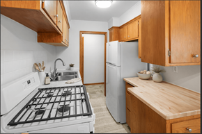 Richfield apartment for rent - A kitchen with a white stove top oven and a white refrigerator.