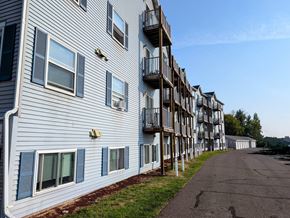 Duluth apartment for rent - a building with balconies and a street in front of it