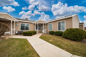 Cottage Grove apartment for rent - A residential building with a driveway in front.