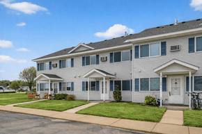 Byron townhouse for rent - A two-story residential building with a white door and windows.