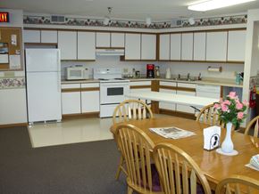 Onalaska apartment for rent - A kitchen with a table and chairs in front of it.