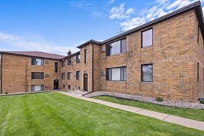 St. Louis Park apartment for rent - A brick building with a green lawn in front.