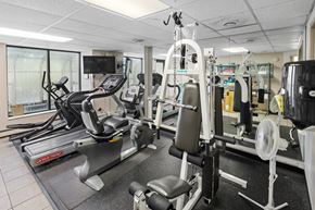 Hopkins apartment for rent - A gym with treadmills, weights, and exercise equipment.