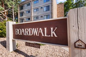 Wayzata apartment for rent - A brown sign that says Boardwalk in front of a building.