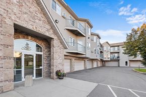 St. Cloud apartment for rent - The image shows a multi-story residential building with a clear blue sky in the background.