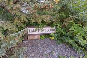 Buffalo apartment for rent - a sign for lake path south in front of some trees