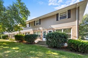 Buffalo apartment for rent - the front of a house with a lawn and shrubs