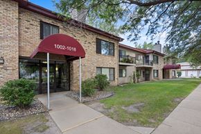 Chaska apartment for rent - A building with the number 1002-1018 on it.