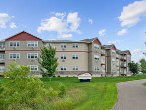 Big Lake apartment for rent - A building with a sign that says "Apartment Homes" in front of it.