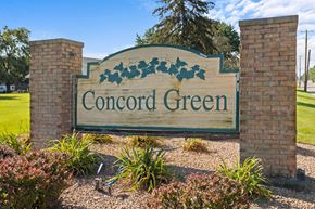 Bloomington apartment for rent - a sign for concord green in front of a park