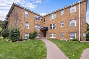 St. Louis Park apartment for rent - A brick building with a walkway in front.