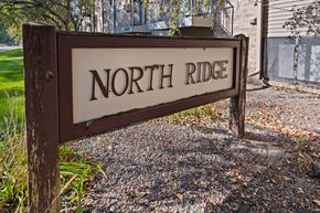 Buffalo apartment for rent - A brown sign that says North Ridge stands in front of a building.