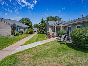 Cottage Grove apartment for rent - Photo of Townhomes showing sidewalks and landscaping