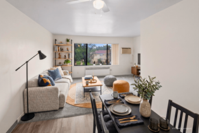 St. Louis Park apartment for rent - A well-lit living room with a dining table set for two.