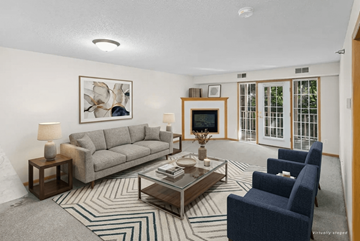 Chaska apartment for rent - A living room with a grey couch, a coffee table, and a painting on the wall.