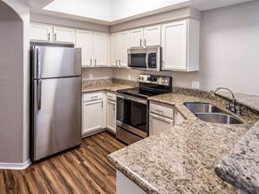 Chandler apartment for rent - a kitchen with granite counter tops and stainless steel appliances