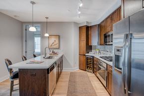 Scottsdale apartment for rent - a kitchen with stainless steel appliances and wooden cabinets