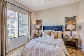 Scottsdale apartment for rent - a bedroom with a bed and a large window