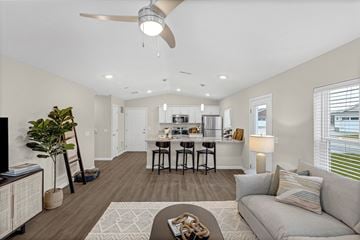 Elyria apartment for rent - A living room with a grey couch and a coffee table.