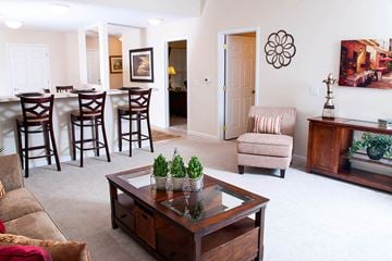 Elyria apartment for rent - a living room and dining room with a table and chairs