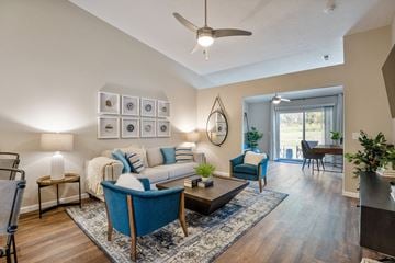 Maumee apartment for rent - a living room with furniture and a ceiling fan