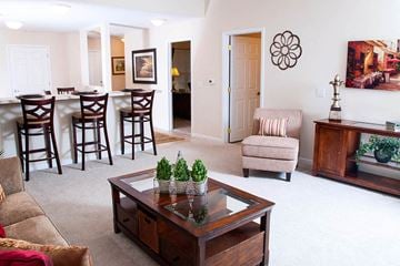Perrysburg apartment for rent - a living room and dining room with a table and chairs