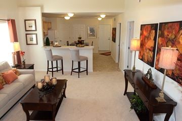 Perrysburg apartment for rent - a living room and kitchen with a couch and a table