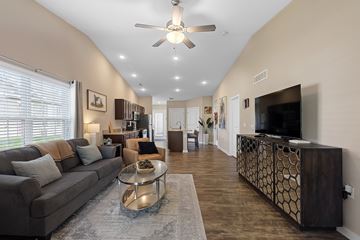 Ankeny apartment for rent - A living room with a grey couch and a coffee table.