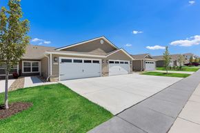 Bennington apartment for rent - A house with a brown roof and a white garage door.
