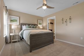 Bennington apartment for rent - A bedroom with a large bed and a ceiling fan.