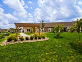 Burlington apartment for rent - A building with a brown roof and a covered walkway.