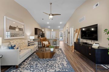Burlington apartment for rent - A living room with a white couch and a coffee table.