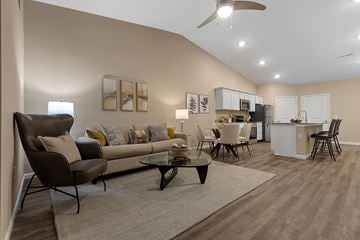 Canton apartment for rent - A living room with a brown couch and a black coffee table.