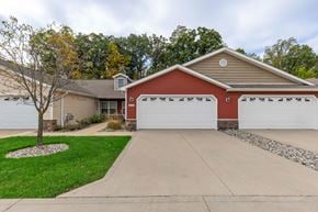 Grand Rapids apartment for rent - A red house with a white garage door.