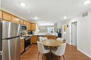 Grand Rapids apartment for rent - A modern kitchen with a table and chairs.