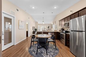 Charlotte apartment for rent - A kitchen with a table and chairs in the middle of the room.