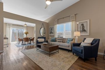 Charlotte apartment for rent - A living room with a dark blue sofa and a coffee table.
