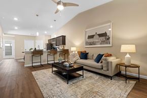 Cincinnati apartment for rent - A living room with a couch, a coffee table, and a ceiling fan.