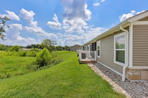Cincinnati apartment for rent - A row of houses with a grassy area in between.
