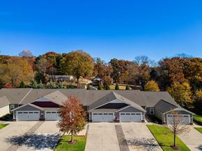 Concord apartment for rent - A row of houses with garages and trees in autumn colors.
