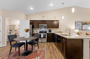Concord apartment for rent - A kitchen with a table and chairs in the middle of the room.