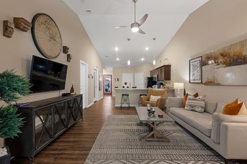 Concord apartment for rent - A living room with a white couch and a wooden floor.