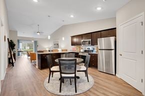 Crystal Lake apartment for rent - A modern kitchen with a dining table and chairs in the middle.